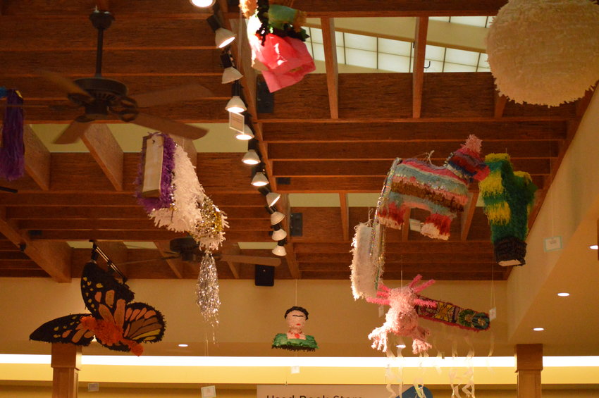 Colorful piñatas hanging in the cafe of Smoky Hill Library on Sept. 14.